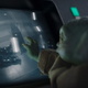 Baby Yoda, aka Grogu, touches a screen on The Mandalorian.